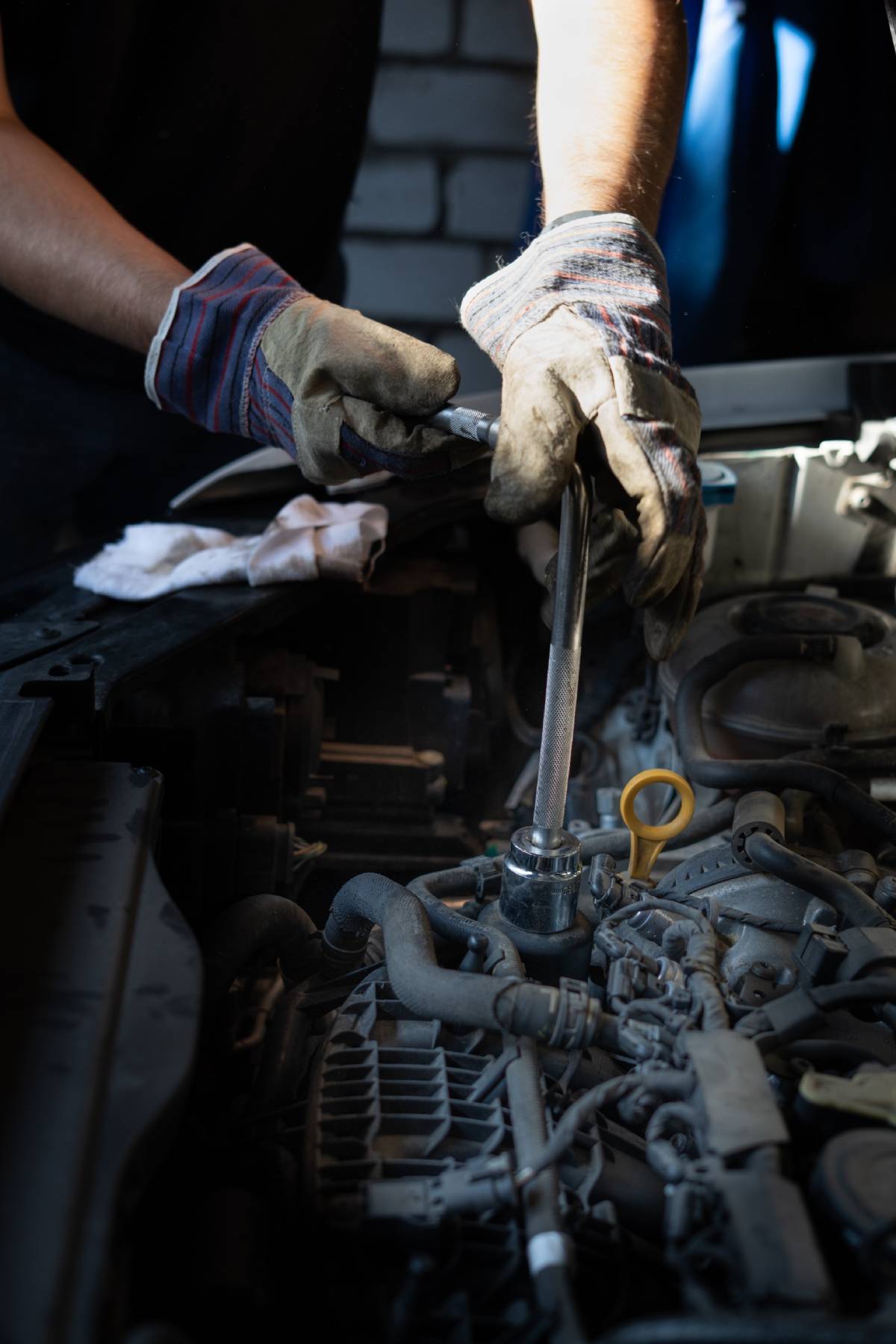 BSC Contact Page Image Man with screwdriver working with engine